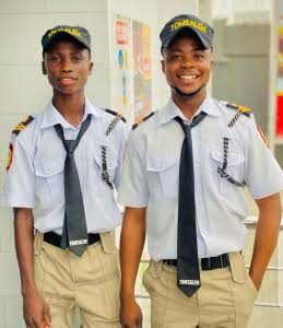 Some Disappointments Are Blessings: Photos Of Sacked Security Guards, Happy Boys In School Abroad 