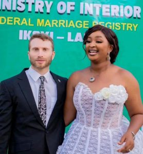 Nollywood actress, Etinosa Idemudia has tied the knot with her Caucasian lover, joining the ranks of newlywed couples. This comes after the actress recently unveiled her Caucasian partner on Instagram, seeking well wishes as she embarks on her new journey. In a recent Instagram story, Etinosa Idemudia revealed her relationship status, confirming she's officially tied the knot. Her announcement was accompanied by a photo showing their intimate court wedding, with the couple sharing a romantic kiss The caption reads,"God did". Meanwhile, the announcement has sparked an outpouring of congratulatory messages from fans and industry colleagues, extending warm wishes for their marital union.